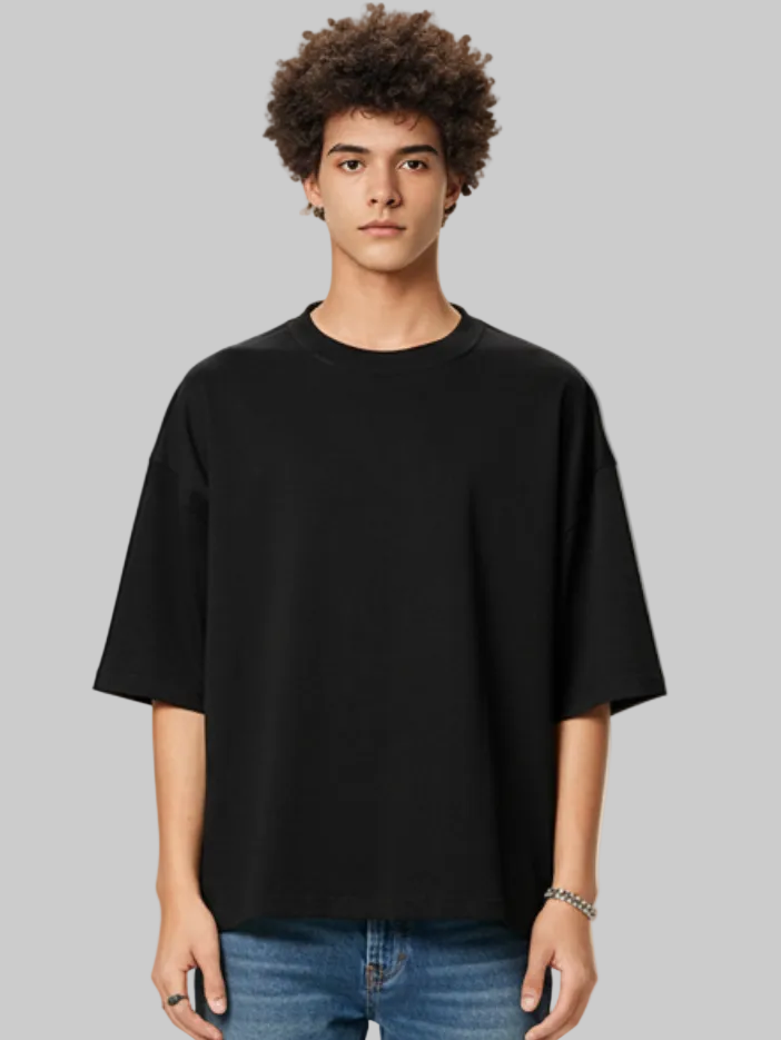 Aero boxy crop tee in black by Apollo Moda, worn by model against a plain background