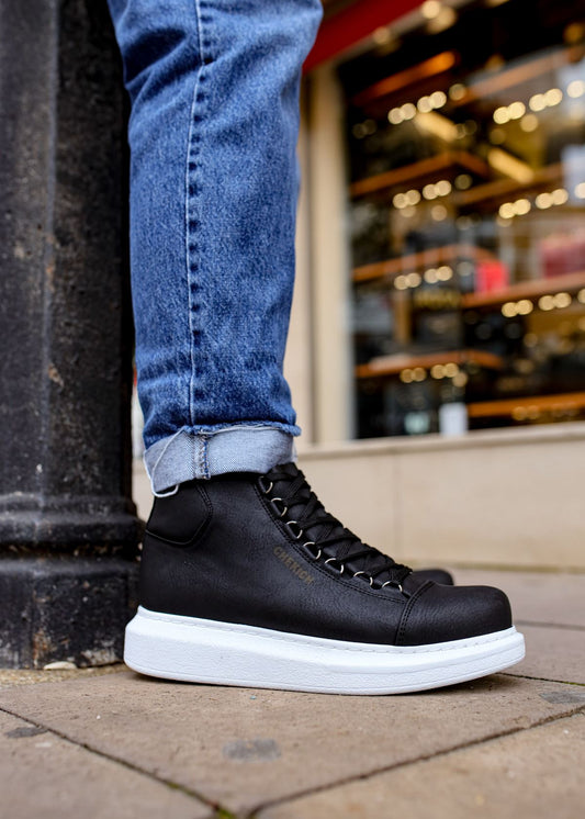 Kelly Midnight Majesty vegan leather high-top boot in black by Apollo Moda, worn with jeans